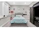 Cozy bedroom with a comfortable bed, decorative posters, and natural light from the window at 5683 Oakmont Blvd, Bargersville, IN 46106