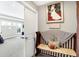 Comfortable bedroom entrance featuring a cushioned bench and decor at 5683 Oakmont Blvd, Bargersville, IN 46106