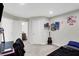 Bedroom with neutral tones, closet, ensuite bathroom, and sports decor at 5683 Oakmont Blvd, Bargersville, IN 46106