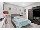 Comfortable bedroom with a cozy bed, decorations, sliding barn door, and carpeted floors at 5683 Oakmont Blvd, Bargersville, IN 46106