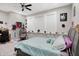 Spacious bedroom with a ceiling fan, and a decorative shelf for books and posters at 5683 Oakmont Blvd, Bargersville, IN 46106