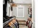 Walk-in closet with shelving, window, and storage bench for organization and natural light at 5683 Oakmont Blvd, Bargersville, IN 46106