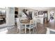 Open-concept dining area and kitchen allow for easy entertainment in a well-lit space at 5683 Oakmont Blvd, Bargersville, IN 46106