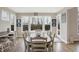This lovely dining area is illuminated by natural light from large windows with backyard views at 5683 Oakmont Blvd, Bargersville, IN 46106