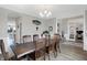 Dining room with a dark wood table and chair set situated near doorways at 5683 Oakmont Blvd, Bargersville, IN 46106