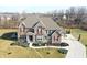 Beautiful two-story brick home with manicured landscaping and a long driveway at 5683 Oakmont Blvd, Bargersville, IN 46106