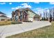 View of the home exterior showing the brick, stone, attached garage and driveway at 5683 Oakmont Blvd, Bargersville, IN 46106