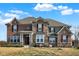 Charming two-story home featuring brick, stone accents, and well-maintained landscaping at 5683 Oakmont Blvd, Bargersville, IN 46106