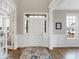 Elegant foyer with white trim, wood floors, and ample natural light at 5683 Oakmont Blvd, Bargersville, IN 46106