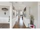 Bright hallway with wood floors and white wainscoting and decor at 5683 Oakmont Blvd, Bargersville, IN 46106