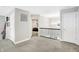 Hallway featuring carpet, a decorative railing, and views into the bedrooms at 5683 Oakmont Blvd, Bargersville, IN 46106