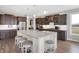 Kitchen area with large island, granite countertops, and stainless steel appliances at 5683 Oakmont Blvd, Bargersville, IN 46106