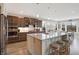 Kitchen with island, granite countertops, stainless steel appliances, and wooden cabinets at 5683 Oakmont Blvd, Bargersville, IN 46106