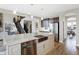 Kitchen island with stainless steel sink, dishwasher, and granite countertops at 5683 Oakmont Blvd, Bargersville, IN 46106