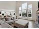 Bright living room features large picture windows overlooking the backyard, next to the dining area and kitchen at 5683 Oakmont Blvd, Bargersville, IN 46106