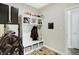 Mud room features a custom storage bench and an interesting metal storage cabinet at 5683 Oakmont Blvd, Bargersville, IN 46106