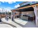 Covered patio area with comfortable seating, ideal for relaxing and enjoying the outdoors at 5683 Oakmont Blvd, Bargersville, IN 46106