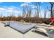 Covered pool area with lounge chairs and well-maintained concrete decking at 5683 Oakmont Blvd, Bargersville, IN 46106