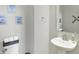 Well-lit powder room with a pedestal sink and toilet with funny decorations at 5683 Oakmont Blvd, Bargersville, IN 46106