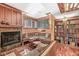 Cozy basement reading nook featuring a fireplace, custom built-ins, and large windows at 5977 S 800 E, Zionsville, IN 46077