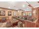 Finished basement area with wet bar, custom millwork, wood floors, and lounge seating at 5977 S 800 E, Zionsville, IN 46077