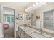 Well-lit bathroom featuring a double vanity, granite countertops, and large mirror at 5977 S 800 E, Zionsville, IN 46077