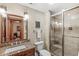 Granite counters and a frameless shower highlight this bathroom's design at 5977 S 800 E, Zionsville, IN 46077
