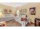 A comfortable bedroom with 2 twin beds has neutral decor and unique art at 5977 S 800 E, Zionsville, IN 46077