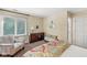 Relaxing bedroom with reading chair, large window, and dresser at 5977 S 800 E, Zionsville, IN 46077