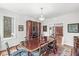 Formal dining room featuring a large table, china cabinet, and views into the foyer at 5977 S 800 E, Zionsville, IN 46077