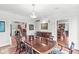 Spacious dining room featuring a large table, hardwood floors, and access to the living room at 5977 S 800 E, Zionsville, IN 46077