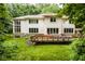 Lush greenery surrounds a beautiful property with an outdoor deck at 5977 S 800 E, Zionsville, IN 46077