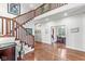 Elegant foyer featuring hardwood floors, a staircase, and views into the dining room at 5977 S 800 E, Zionsville, IN 46077