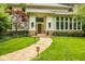 Inviting home featuring a stone walkway leading to a front entrance with a solid wood door and a manicured lawn at 5977 S 800 E, Zionsville, IN 46077