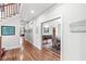 Hallway featuring hardwood floors, artwork, and access to multiple rooms at 5977 S 800 E, Zionsville, IN 46077