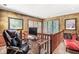 Second-story office space with desk and seating area and great natural light from large windows at 5977 S 800 E, Zionsville, IN 46077