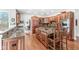 Gourmet kitchen featuring custom wood cabinetry, granite countertops, and a center island with seating at 5977 S 800 E, Zionsville, IN 46077