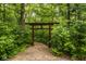 Pathway with a wooden Japanese-style gate amidst lush greenery at 5977 S 800 E, Zionsville, IN 46077