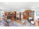 Open-concept living area with wood floors, wood cabinets, and seamless transition to the kitchen with a comfortable layout at 5977 S 800 E, Zionsville, IN 46077