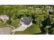 Aerial view showcasing the house's large lot, landscaped yard and mature trees at 6208 W Foster Ridge Ln, Pendleton, IN 46064