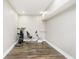 Well-lit basement area features modern exercise equipment and finished flooring at 6208 W Foster Ridge Ln, Pendleton, IN 46064