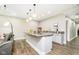 Finished basement with wet bar, countertop seating, modern lighting and a leather sofa at 6208 W Foster Ridge Ln, Pendleton, IN 46064