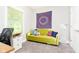 Bright bedroom featuring a couch, desk, and natural light at 6208 W Foster Ridge Ln, Pendleton, IN 46064