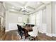 Elegant dining room with coffered ceilings, modern lighting, and a large wooden table with seating for six at 6208 W Foster Ridge Ln, Pendleton, IN 46064