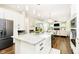 Open-concept kitchen featuring an island with a breakfast bar, connecting seamlessly to the living area at 6208 W Foster Ridge Ln, Pendleton, IN 46064