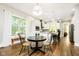 Charming eat-in kitchen featuring white cabinets, stainless appliances, and large windows at 6208 W Foster Ridge Ln, Pendleton, IN 46064