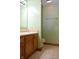Bright half bathroom has a wood cabinet, ceramic tiled floor, and toilet at 6725 Bridgefield Way # 1, Indianapolis, IN 46254