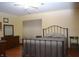 Bedroom with hard floors, metal bed frame, window, and full furniture set at 6725 Bridgefield Way # 1, Indianapolis, IN 46254