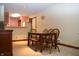 Inviting dining area featuring a wooden table, chairs, and a cozy ambiance at 6725 Bridgefield Way # 1, Indianapolis, IN 46254