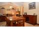 Inviting dining area with wood table, chairs, and a decorative fireplace in a well-lit, stylish setting at 6725 Bridgefield Way # 1, Indianapolis, IN 46254
